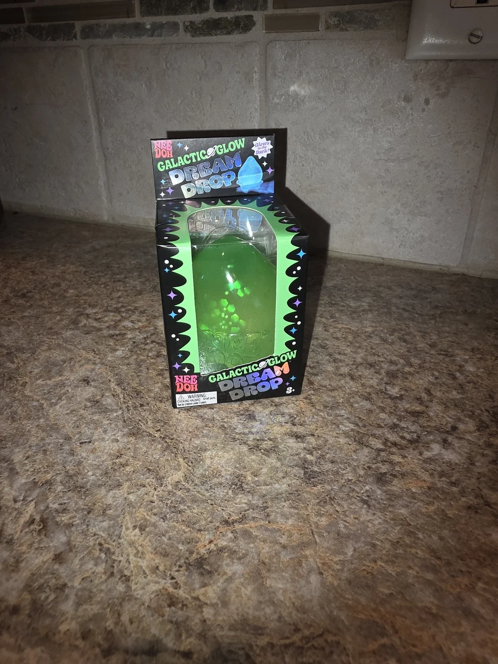 NeeDoh Galactic Glow Dream Drop Squishy Glow in the Dark Fidget Toy Cosmic Bloom